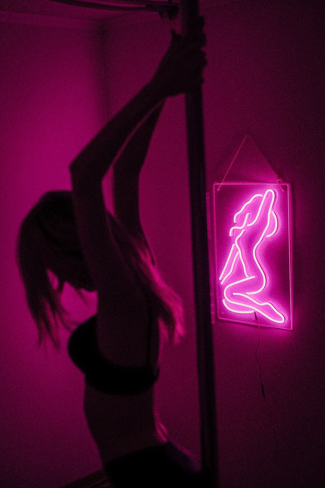 Sexy girl woman pink neon sign for bar, night club, party, erotic striptease